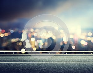 Asphalt road and blurred city