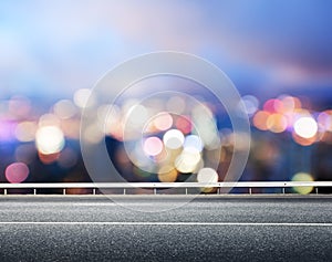 Asphalt road and blurred city