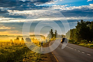 Asphalt road and car, earl morning