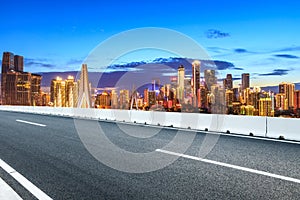 Asphalt road and Chongqing night cityscape