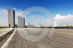 Asphalt road and city building