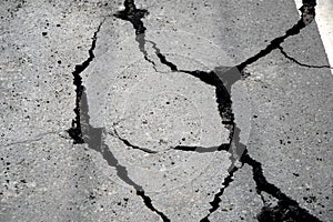 Asphalt road crack into pieces