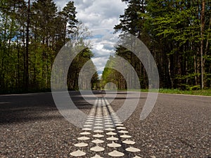 Asphalt road through the deep forest. Nature background.