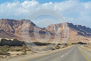 Asphalt road in desert Negev, Israel, road 40, transport infrastructure in desert, scenic mountains route in Mizpe Ramon canyon i