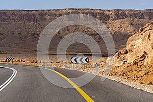 Asphalt road in desert Negev, Israel, road 40, transport infrastructure in desert, scenic mountains route in Mizpe Ramon canyon i