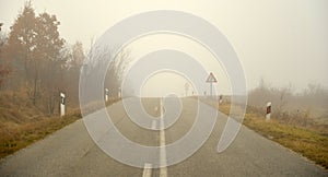 An asphalt road with fog in winter