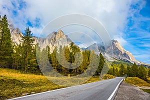 Asphalt road at the foot of the mountains