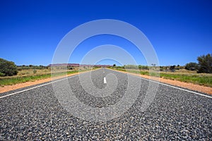 Asphalt road, gravel close up. Perspective view