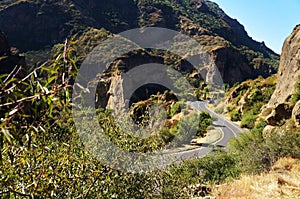 Asphalt road among high stone mountains!