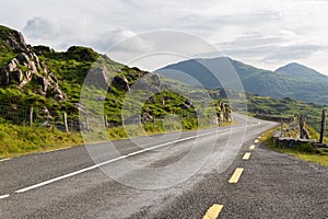 Asphalt road and hills at connemara in ireland