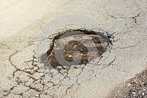 Asphalt road hole damage