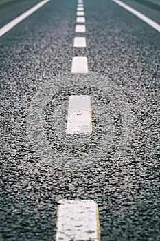 Asphalt road markings white line, broken line traffic indicator