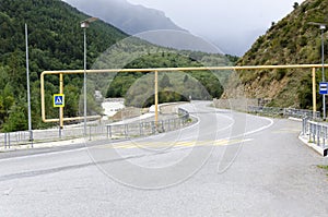 Asphalt road among mountains