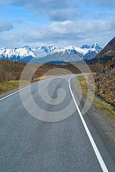 Asphalt road in Norvegian mountains photo