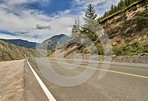 asphalt road passing through the mountains