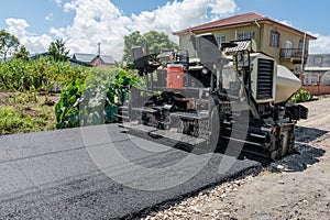 Asphalt road paver paiving machine construction industry roadwork repair photo