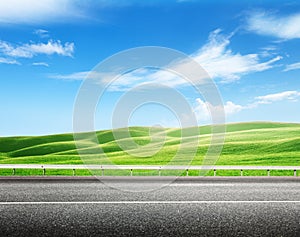 Asphalt road and perfect field