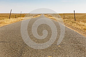 Asphalt road in the steppe with wind generators on the horizon, Inner Mongolia