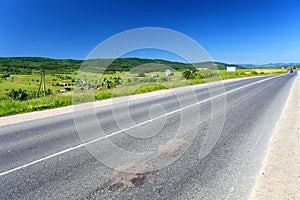 Asphalt road in summer day