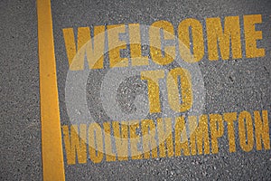 asphalt road with text welcome to Wolverhampton near yellow line photo