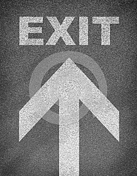 Asphalt road texture with arrow and word exit