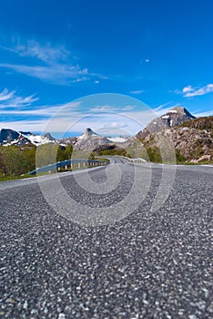 Asphalt road to Norvegian mountains photo