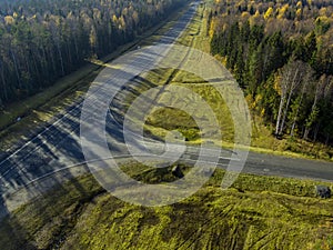 Asphalt road for travel in pine forest aerial view