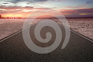 Asphalt road with tree and drought land