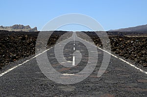 Asphalt road under blue sky