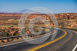 Asphalt road in USA. Barren scenery. Desert highway of the American southwest. Endless straight. Route 66, Arizona