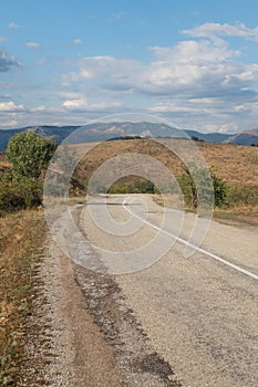 Asphalt road with white dividing strip