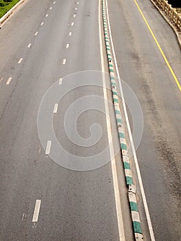 Asphalt road with white stripes