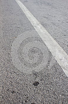 Asphalt road with white stripes