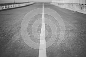 Asphalt road with white stripes