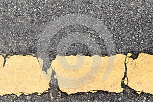 Asphalt road and yellow dividing lines.