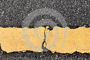 Asphalt road and yellow dividing lines.