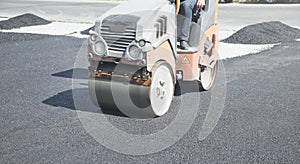 Asphalt roller. Industry. Work. New road