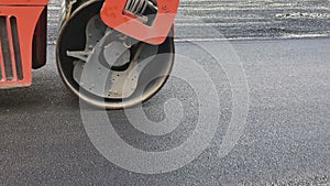Asphalt roller leveling road pressure. Repair smooth surface industrial highway.