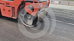 Asphalt roller leveling road pressure. Repair smooth surface industrial highway.