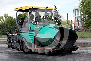 Asphalt spreading machine. Road paving