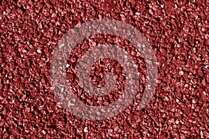 Asphalt texture in red tone.