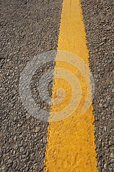 Asphalt texture with yellow stripe-Rural Road-A curved tarmac road-textured asphalt road with cracked yellow marking-asphalt road