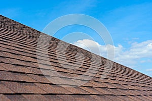 Asphalt tile roof on new home under construction