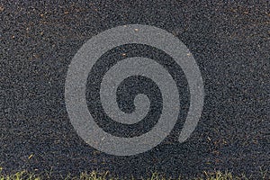 Asphalt used for surfacing roads, local street cover with asphalt, black rough textured background