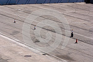 Asphalted area with cones to signal the road to follow the cars