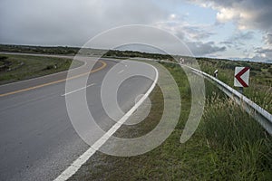 asphalted road that ascends between the mountains