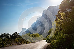 asphalted road in the mountains, beautiful sunshine,