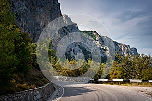 Asphalted road in the mountains, beautiful sunshine, summer vacation time