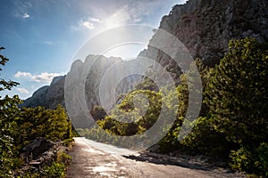 Asphalted road in the mountains, beautiful sunshine, summer vacation time