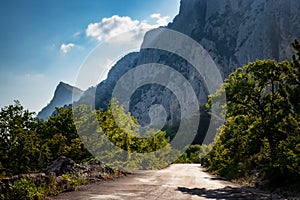 Asphalted road in the mountains, beautiful sunshine, summer vacation time